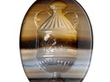a picture of a glass vase with a horse in it