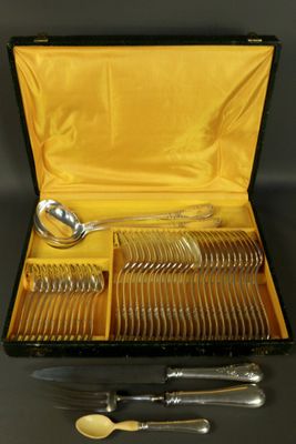 a box with a set of silverware in it on a table