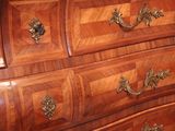an image of a wooden dresser with many drawers