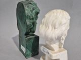 pair of marble busts of a man and a bust of a woman
