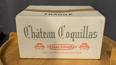 a box that is sitting on top of a wooden barrel