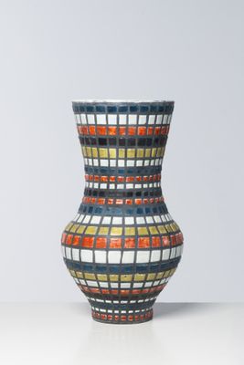 a vase that is sitting on a white table