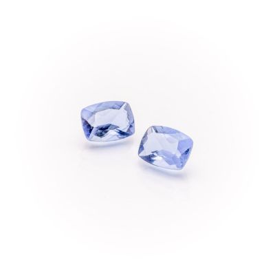 a pair of blue sapphires on a white background