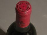 a bottle of wine that is sitting on a table