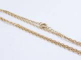 a gold plated necklace with a chain that is attached to it