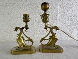 pair of antique brass candlesticks on marble bases