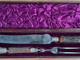 a knife and a knife holder in a purple box