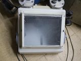 a microwave sitting on the floor next to other appliances