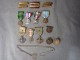 several medals and medals are arranged on a gray surface