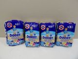 three packs of baby diapers sitting on top of a white counter