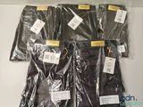 four bags of clothing on a table with tags on them