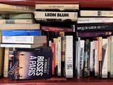 a red box filled with books on top of a table