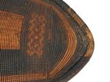 a close up view of a woven basket on a white surface