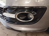 a close up of a car ' s headlight and front bumper