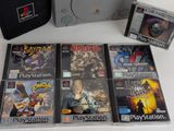 a lot of video games on the table next to a bag