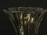 a glass vase that is sitting on a table