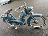 a blue motorcycle parked on the side of the road