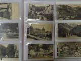 a lot of old postcards that are on the table
