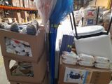 a cart full of boxes and a blue umbrella