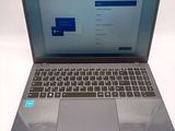 a laptop that is open on a white surface