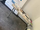 a table that has a bunch of magazines on it
