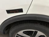 a sticker on the side of a white car