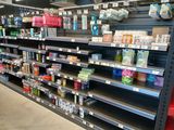 a lot of items on the shelves in the store