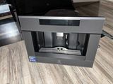 a coffee machine that is sitting on the floor
