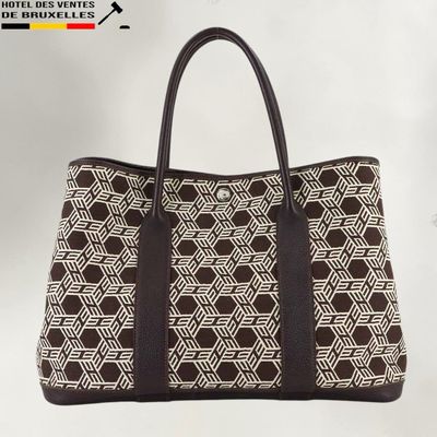 a black and white handbag with a geometric pattern on it