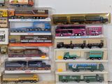 many different types of toy trains and trucks on display