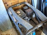 a machine that is sitting on the floor in the garage