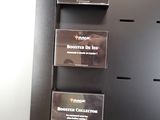 three boxes of cigarettes on a shelf next to a computer