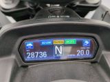 a close up of a motorcycle with a gps display on the back of it