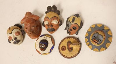 several different types of masks are displayed on a white surface