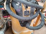 an image of a vacuum and other tools in a garage