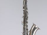 a close up of a saxophone on a white background
