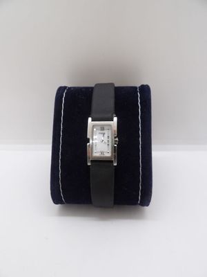 a watch that is sitting on top of a velvet case