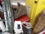 a pile of assorted items sitting in a room