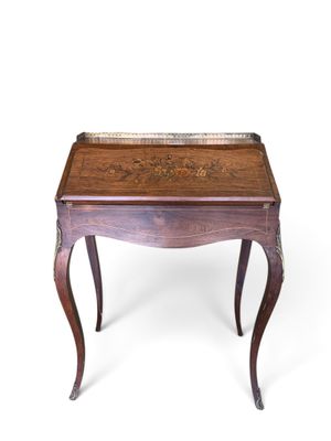 an image of a small wooden table with a tray on it