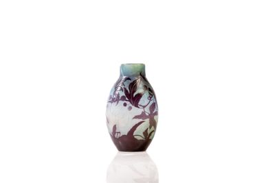 a vase that is sitting on a table with a white background