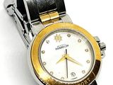 an image of a close up of a wrist watch on a white surface