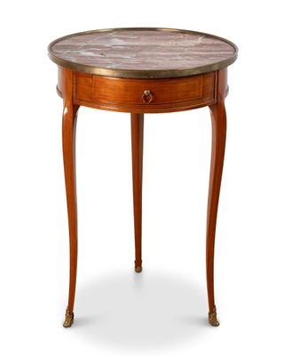 une image d'une petite table avec un plateau en marbre