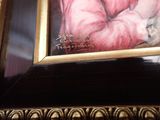 a picture of a painting of a woman holding a baby