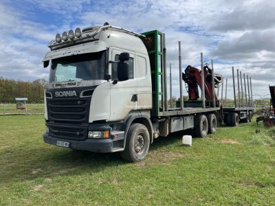 a truck that has a horse on the back of it
