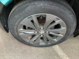 a close up of a tire on a car ' s rim