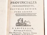 an open book with a black and white image of a man on a horse