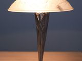 a lamp that is sitting on a wooden table