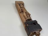 a piece of wood that has been carved into it