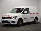 a white van parked in a room with a checkered floor