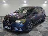 the blue car is parked on a checkered floor in a showroom